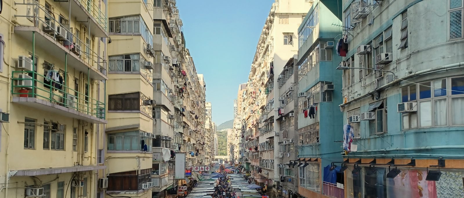 A market street between tong lau blocks on Fa Yuen Street, Mong Kok, Kowloon.